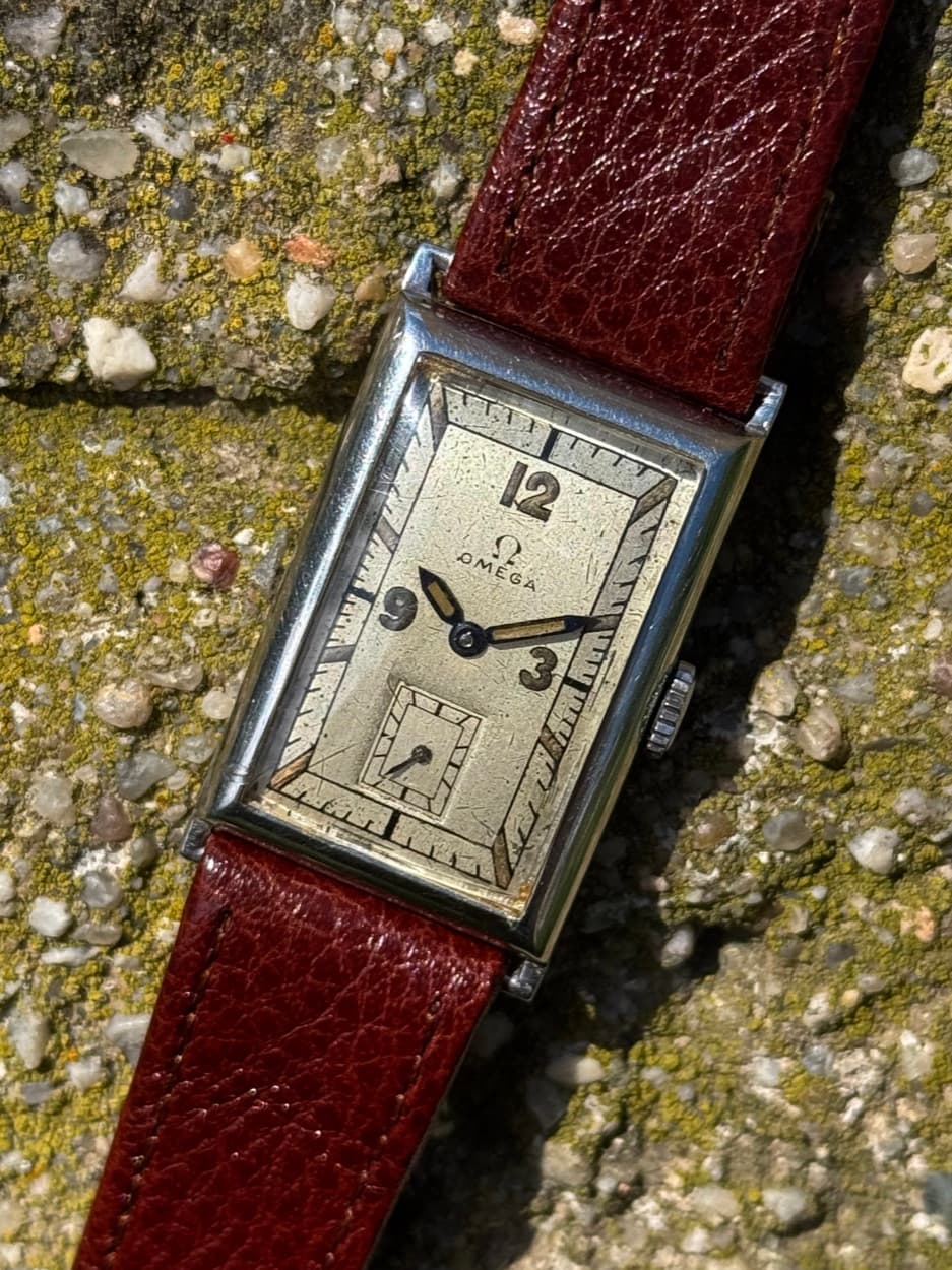 Vintage rectangular tank watch on an oxblood leather strap
